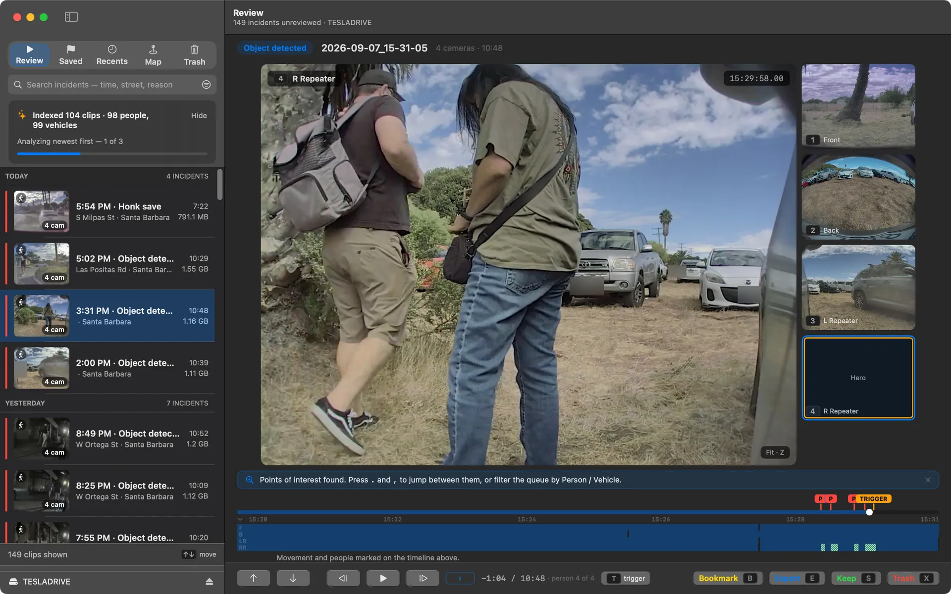Curbwatch on a Mac. The review queue lists today's events down the left. The selected event plays on the right from four cameras at once: two people stand beside the parked car, and markers on the timeline show where a person appears.